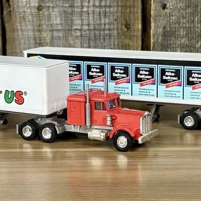Sale Photo Thumbnail #540: A Pair of Lionel Die-cast Semi-Tractor Trailers with Toys R Us and Alka-Seltzer Branding