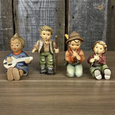 Sale Photo Thumbnail #28: A Set of Four Goebel M.I. Hummel Hand-Painted Ceramic Musical and Wandering Child Figurines