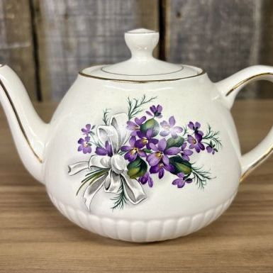 Sale Photo Thumbnail #376: Ellgreave Wood and Sons Ironstone Teapot with Violet and Ribbon Motif
