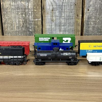 Sale Photo Thumbnail #603: A Collection of Seven Life-Like HO Scale Model Train Pieces Including Southern Diesel Locomotive