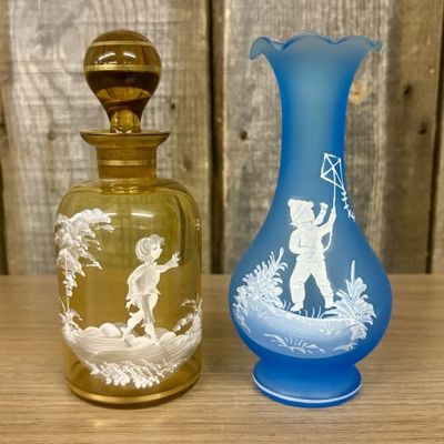 Sale Photo Thumbnail #68: Two Mary Gregory Glass Items Including an Amber Decanter and a Frosted Blue Vase