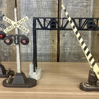 Sale Photo Thumbnail #558: A Group of Vintage Lionel O-Gauge Model Railroad Crossing Accessories