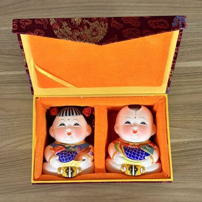 Sale Photo Thumbnail #440: A Pair of Wuxi Huishan Da A Fu Clay Figurines in Presentation Box