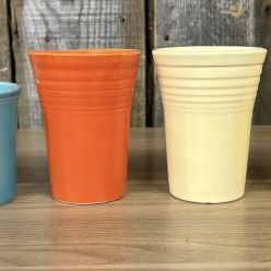 Sale Photo Thumbnail #147: A Collection of Homer Laughlin Fiestaware including a Ring Handle Mug and Water Tumblers