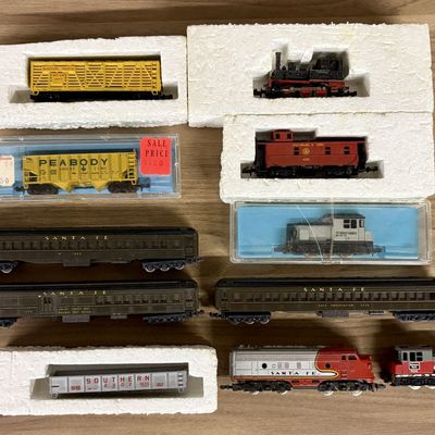 Sale Photo Thumbnail #602: A Collection of Eleven Vintage N-Scale Model Train Locomotives and Rolling Stock Including Lima and Atlas Examples