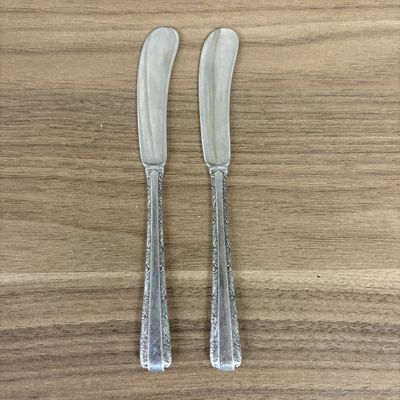 Sale Photo Thumbnail #418: A Pair of Towle Sterling Silver Individual Butter Spreaders in the Candlelight Pattern