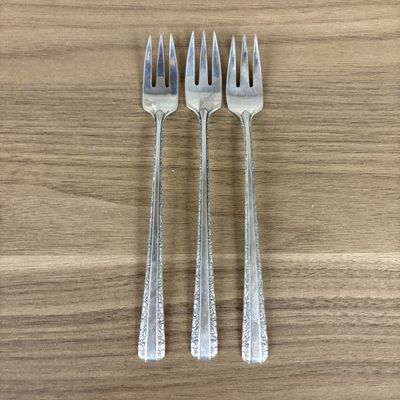 Sale Photo Thumbnail #424: A Trio of Towle Sterling Silver Cocktail Forks in the Candlelight Pattern