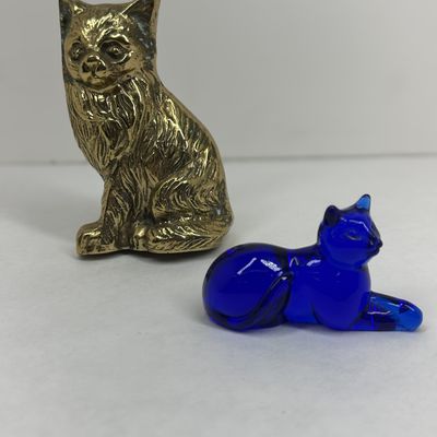 Sale Photo Thumbnail #499: TWO BRASS AND COBALT GLASS CAT FIGURINES