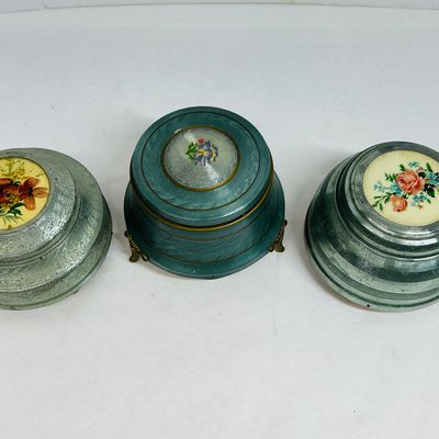 Sale Photo Thumbnail #124: THREE ALUMINUM MUSICAL POWDER BOXES, C. 1940