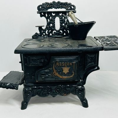 Sale Photo Thumbnail #238: CRESCENT CAST IRON MINIATURE STOVE CIRCA 1900