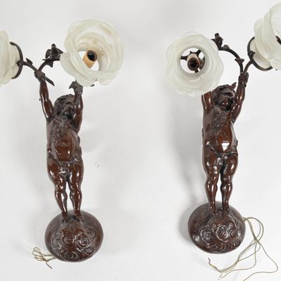 Sale Photo Thumbnail #285: A Pair of Cast Metal Figural Cherub Wall Sconces with Rose Form Glass Shades