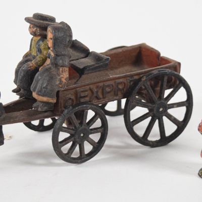 Sale Photo Thumbnail #208: A Group of Antique Cast Iron Toys Including a Goat-Drawn Wagon and Figures