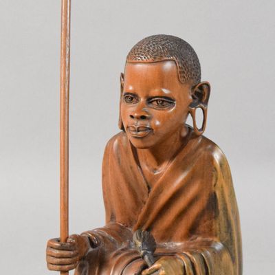 Sale Photo Thumbnail #304: Carved Wood Seated East African Figure with Accessories