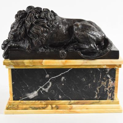 Sale Photo Thumbnail #221: A Bronze Sculpture of a Reclining Lion on a Giallo Antico and Portoro Marble Pedestal