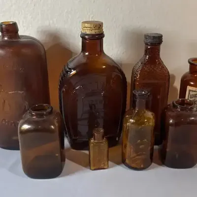 Assorted Amber Glass Advertising & Medicine Bottles – 8 Pieces
