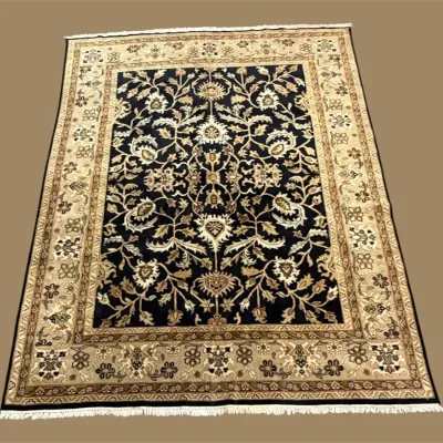 Black and Ivory Floral Area Rug – A dramatic dark field paired with an ornate cream and gold border for a sophisticated statement.