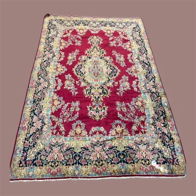 Vibrant Red Traditional Rug – An eye-catching red field with an ornate central medallion and detailed floral border.