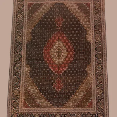 Dark Traditional Medallion Rug – A rich, intricate design featuring a deep field, central red medallion, and finely detailed border.