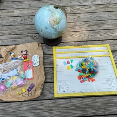 Lot of toys including disney and a globe