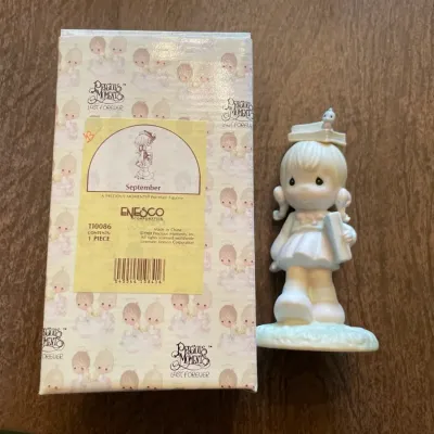 September precious moments figurine with box