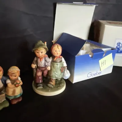Two couple hummel figurines with boxes