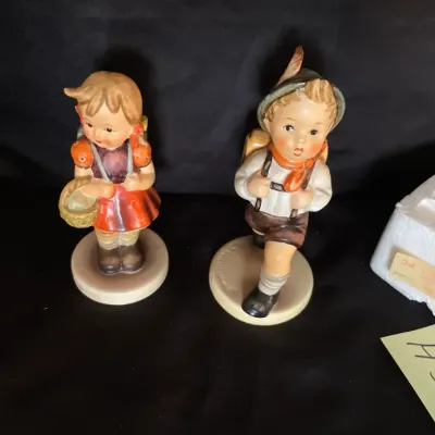 Pair of school boy and girl hummel figurines