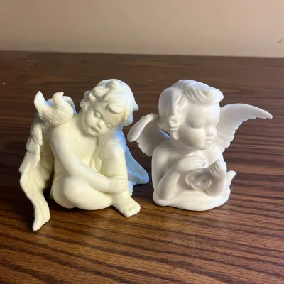 k Set of Two White Porcelain Cherub Figurines with Detailed Wings and Doves.jpg