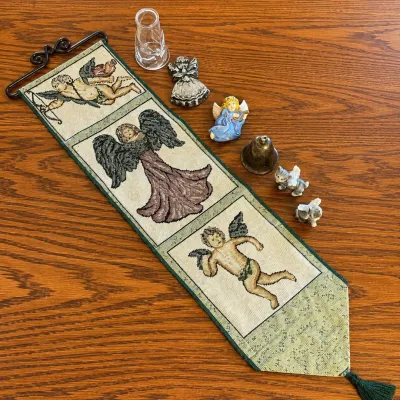 K angel and figurine collection with embroidered wall hanging