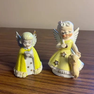 k Ceramic Angel Figurines with Hand-Painted Yellow Attire and Delicate Wings.jpg