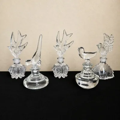 a3 Set of Five Vintage Clear Glass Perfume Bottles with Ornate Bird Stoppers .jpg