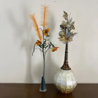 ld Assortment of Decorative Vases Featuring a Tall Clear Glass Vase and a Globe Style Vase with Long Neck.jpg