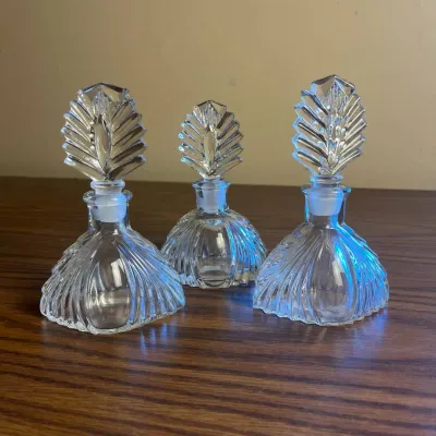 p Vintage Glass Perfume Bottles with Intricate Leaf Design Stoppers H- 6 in and 5.5 in .jpg