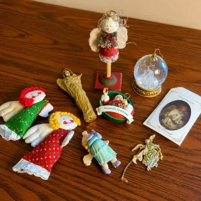 H christmas ornament collection featuring angels santa and snow globe