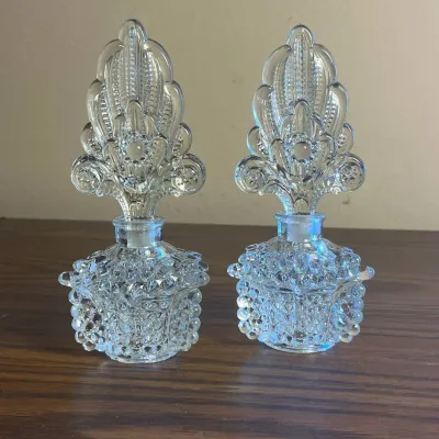 p Pair of Clear Glass Hobnail Styled Perfume Bottles with Ornate Floral Stoppers 7in.jpg