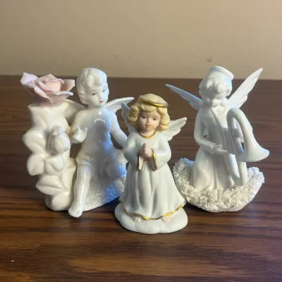 k Set of Three Angel and Fairy Figurines with Floral and Musical Details.jpg