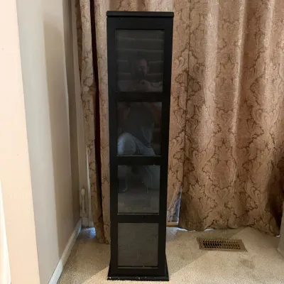 F tall black cabinet with four shelves 49in h x 10 5in w x 7 5in d