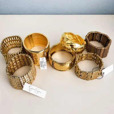 a 7 Elegant Gold Tone Statement Bracelets, Some NWT- Chico's, Jessica Simpson, & others.jpg