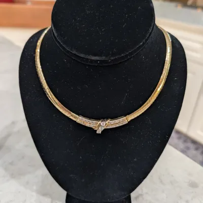 14 karat gold with some 3 large stones are crystal smaller diamonds are natural diamonds. $3,600.00