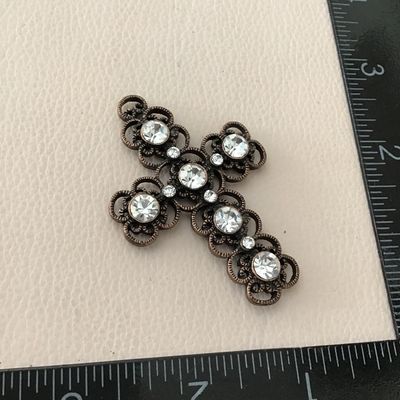 Beautiful copper, toned, intricate design, cross pendant