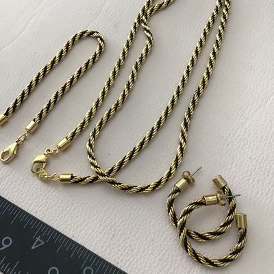 Vintage Avon, gold tone with black rope French twist, necklace and earring bracelet set excellent condition