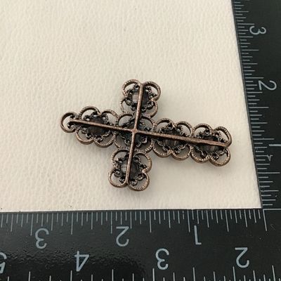 Beautiful copper, toned, intricate design, cross pendant