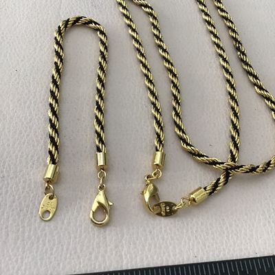Vintage Avon, gold tone with black rope French twist, necklace and earring bracelet set excellent condition