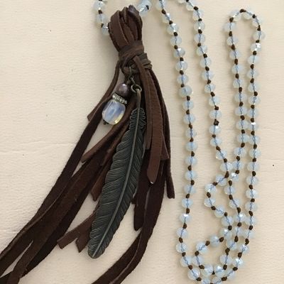 Beautiful bohemian style necklace with brown leather fringe, tassel, and metal, feather charm, and opalite bead necklace