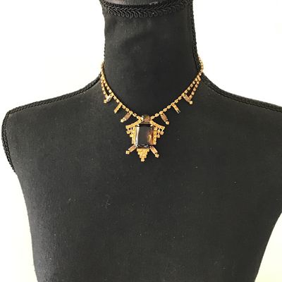 Beautiful vintage, mid-century, large emerald, cut smoky topaz or amber colored center rhinestone accented with yellow and topaz colored...