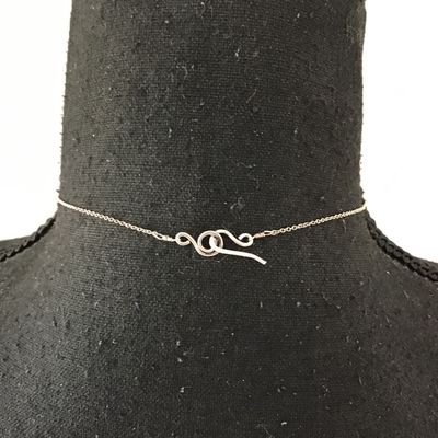 Minimalist silver bar necklace, featuring a small Denzel set red garnet or ruby gemstone on a delicate chain