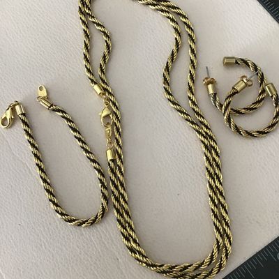 Vintage Avon, gold tone with black rope French twist, necklace and earring bracelet set excellent condition