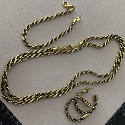 Vintage Avon, gold tone with black rope French twist, necklace and earring bracelet set excellent condition
