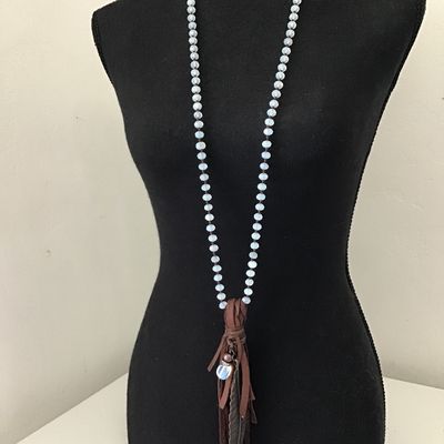 Beautiful bohemian style necklace with brown leather fringe, tassel, and metal, feather charm, and opalite bead necklace