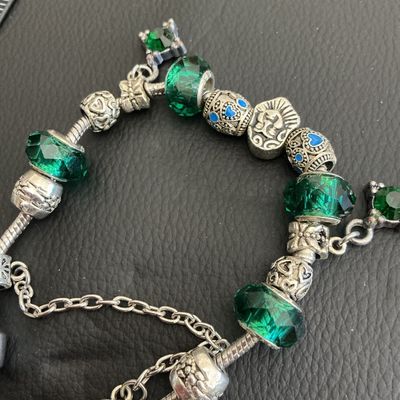 Beautiful pandora style bracelet with green glass beads with 925 markings