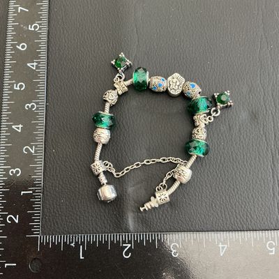 Beautiful pandora style bracelet with green glass beads with 925 markings